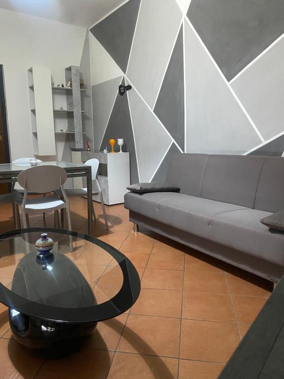 a living room with a couch and a table at Irnohouse in Salerno