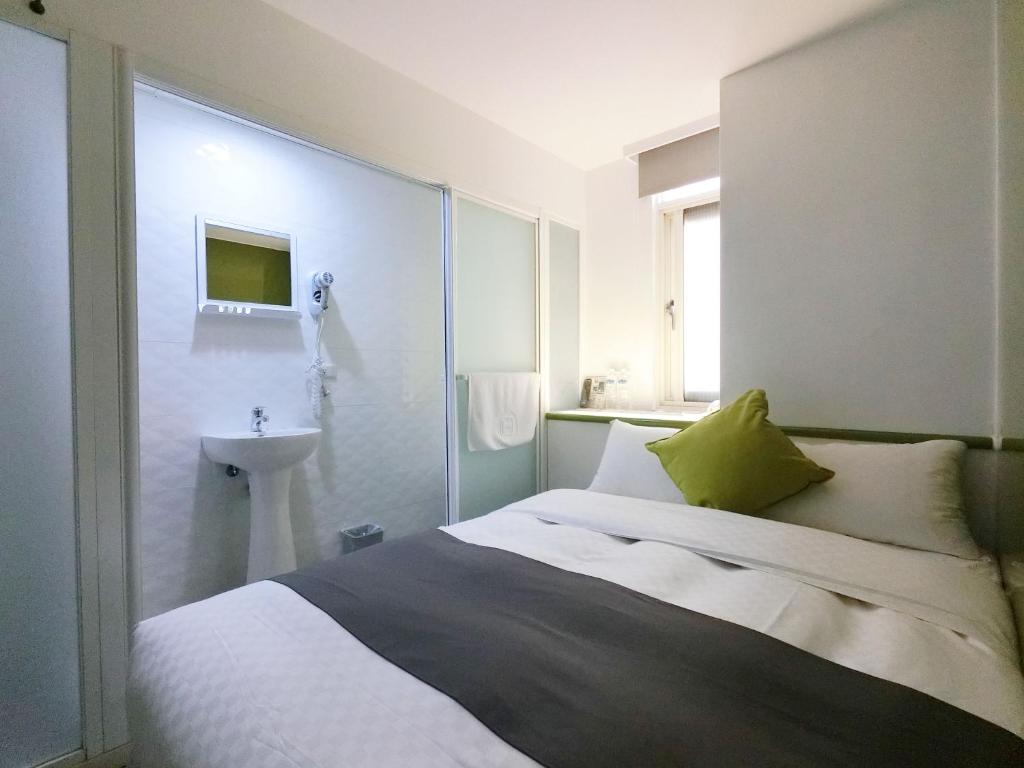 Postel nebo postele na pokoji v ubytování T.O. Hotel Chengde