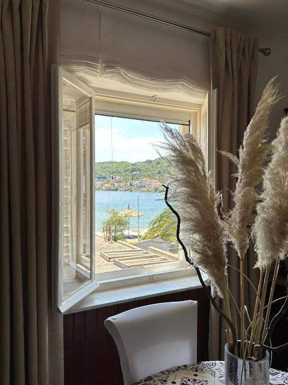 a window with a view of the water at Apartment Abba in Kali