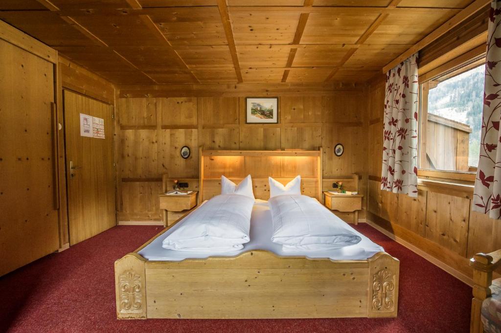 Postel nebo postele na pokoji v ubytování Alpengasthof Zollwirt