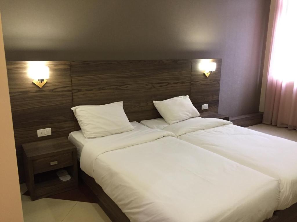 Postel nebo postele na pokoji v ubytování Primer Hotel