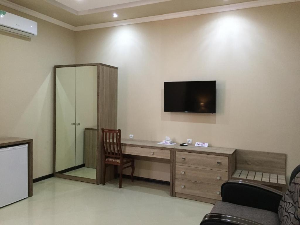 TV a/nebo společenská místnost v ubytování Primer Hotel