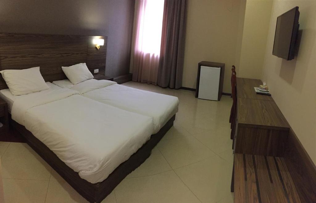 Postel nebo postele na pokoji v ubytování Primer Hotel