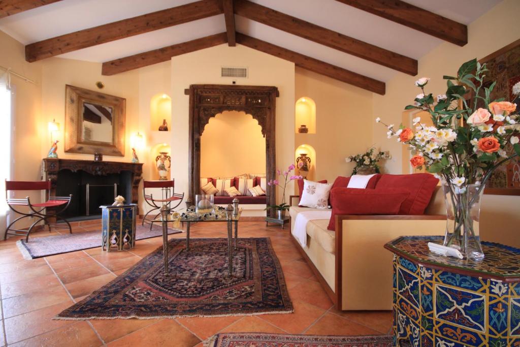 a living room with a couch and a fireplace at Casa Sultana in Propriano
