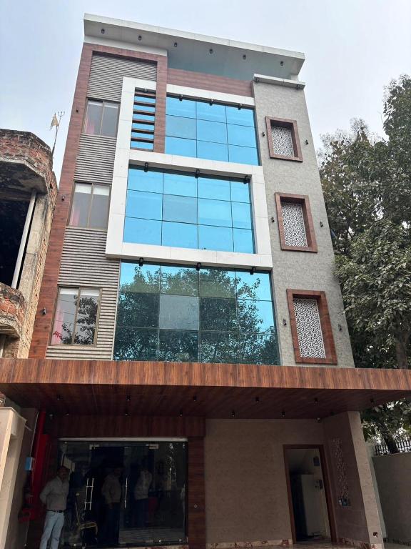 a building with a lot of windows on it at Hotel Ramya in Varanasi