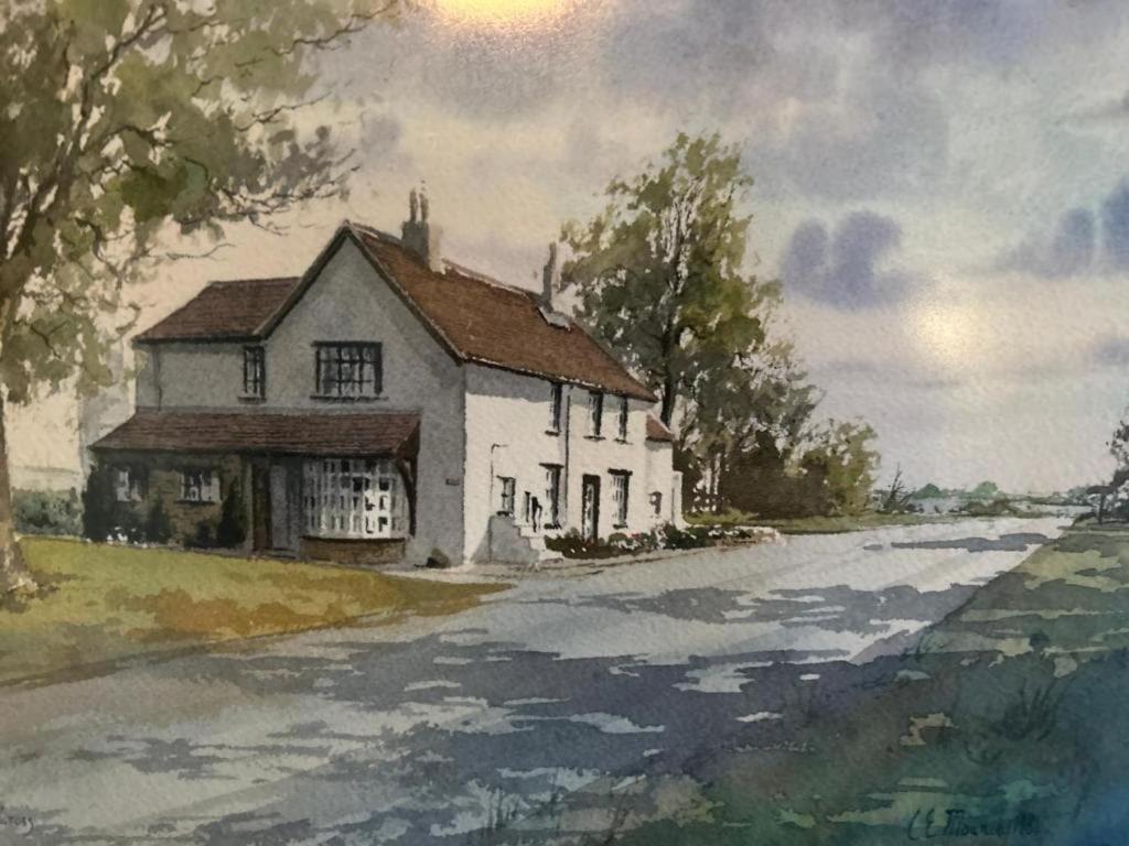 a painting of a house on the side of a road at Lucy Cross Farm Cottage in Richmond