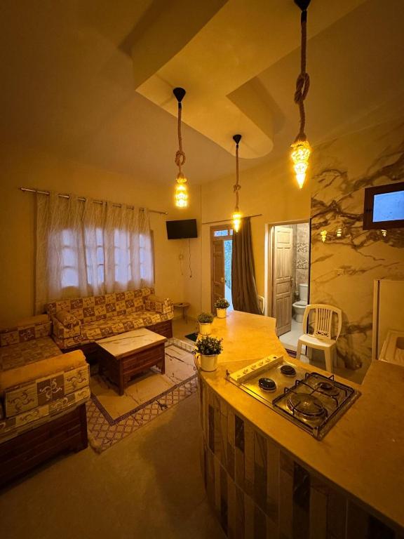 a living room with a couch and a table at Golden Dunes in Tozeur