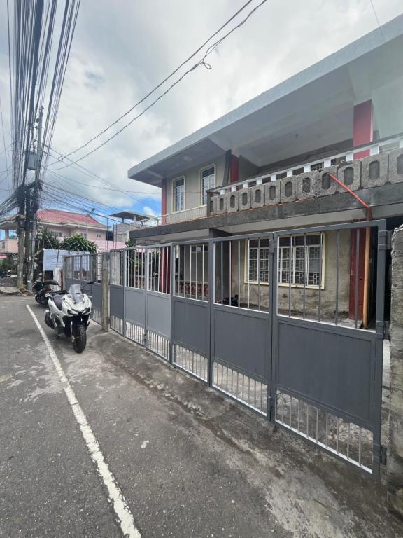 a motorcycle parked in front of a building at E&E Residence in Locsin