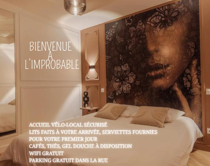 a poster of a bed with a picture of a woman at L'improbable raffiné, élégant et chaleureux in Les Hauts-Saint-Jean