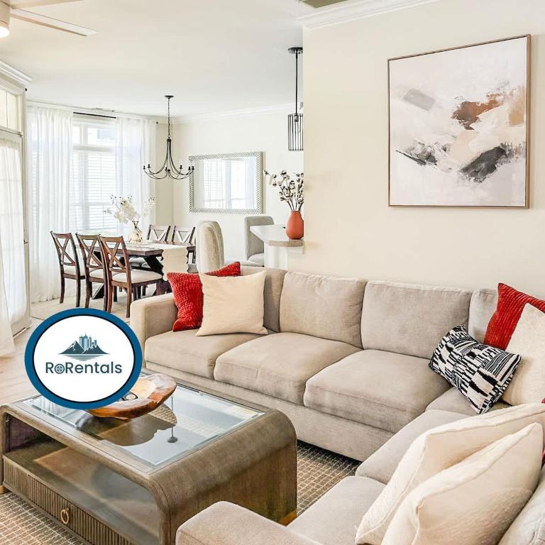 a living room with a couch and a table at Spacious Private 2BR-2BA I Pool I Garage I Central in Rehoboth Beach