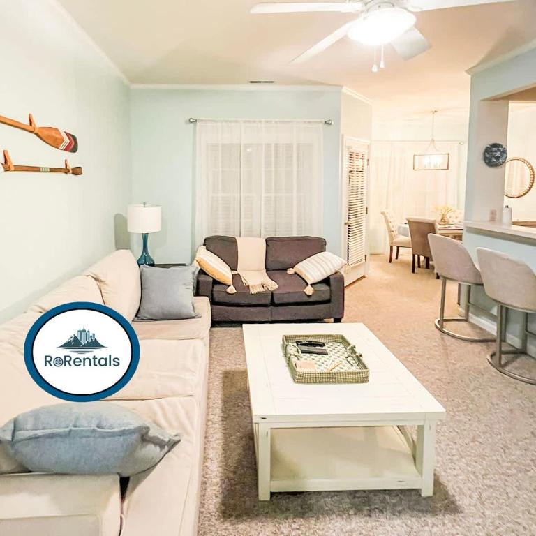 a living room with a couch and a table at Beach perfect getaway 2 bedroom apartment in Rehoboth Beach