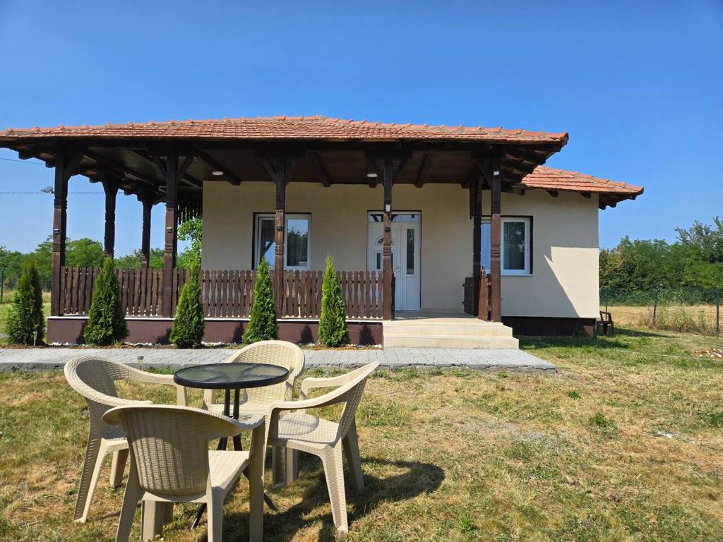 a table and chairs in front of a house at Konak Kragujevac in Kragujevac