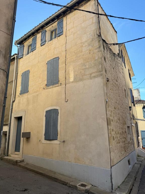 an old building on the side of a street at Blue house in Saint-Gilles