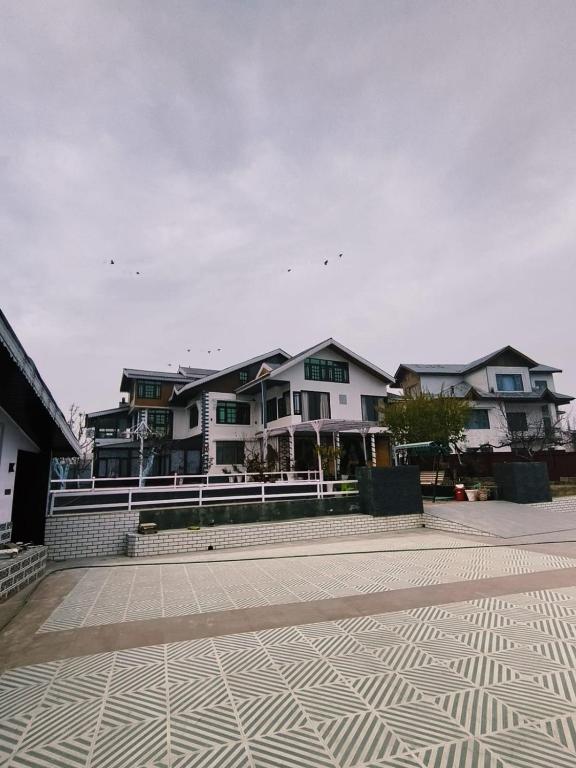 a group of houses on a street at Id villa in Tangmarg