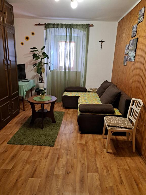 a living room with a couch and a table at Apartman Kadić Senj in Senj