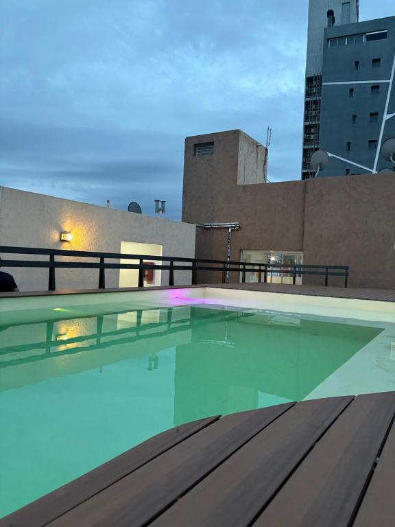 a swimming pool on the roof of a building at Amelia 2-4 in Villa Carlos Paz