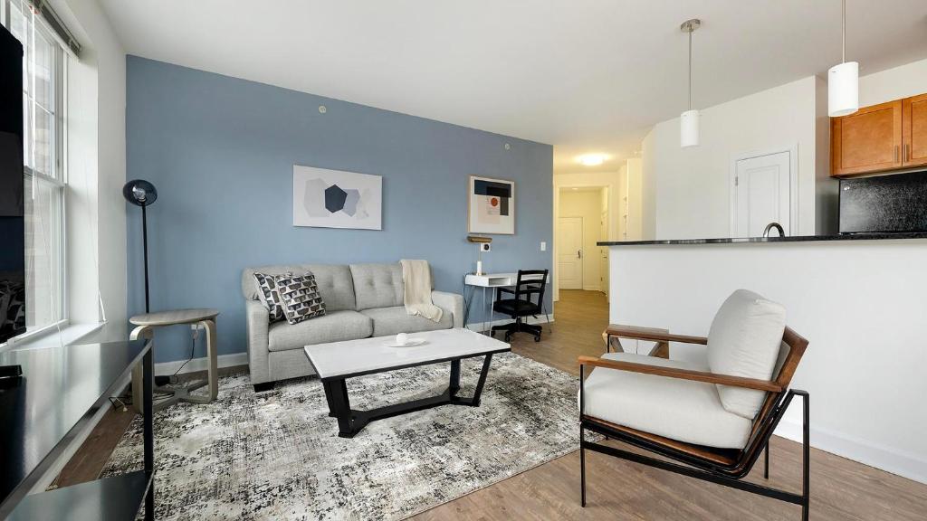 a living room with a couch and a table at Landing Apartments - Prospect Hall in Frederick