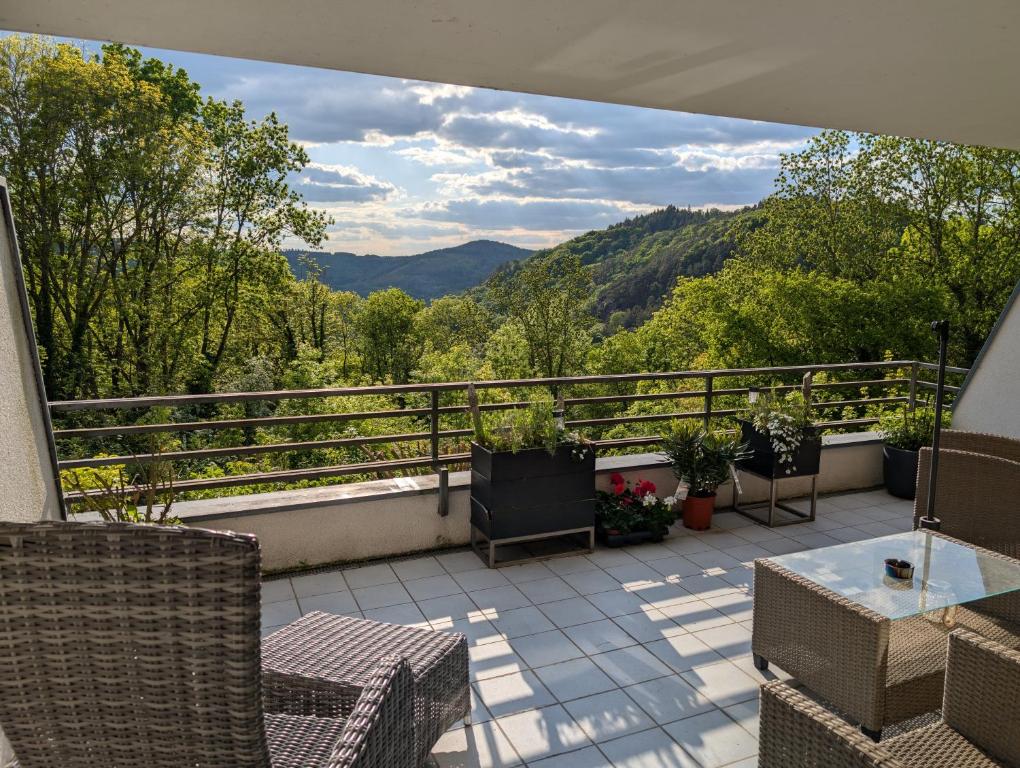 a balcony with a view of the mountains at Panorama Eifel View in Nideggen