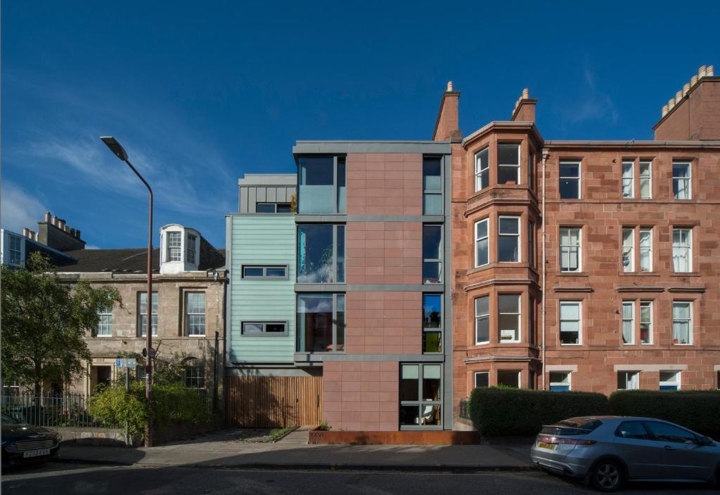 an apartment building with a car parked in front of it at Flat 4A in Edinburgh