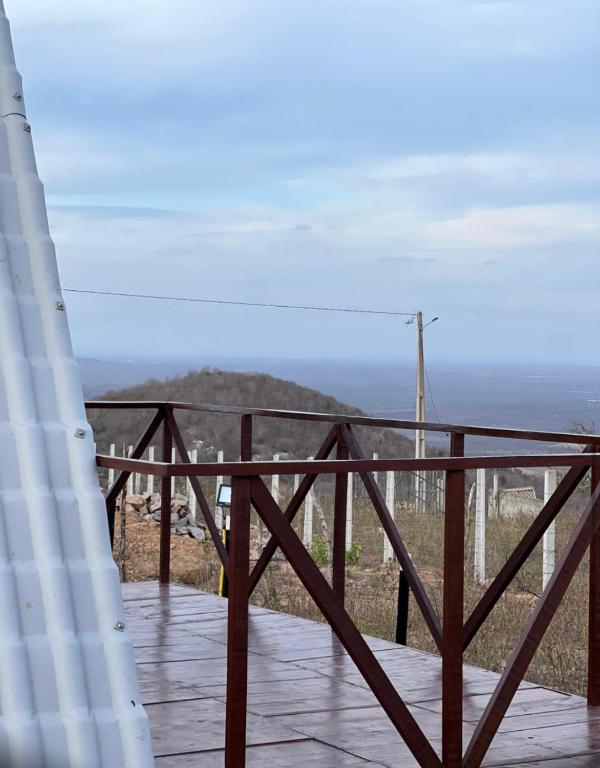 a balcony with a view of the ocean at Chalé serra da formiga in Riachuelo