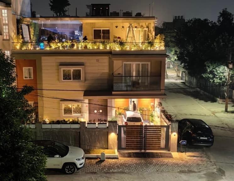 a house with two cars parked in front of it at Shobhalay- Premium 2BHK Parking prime location super interior in Rānchī