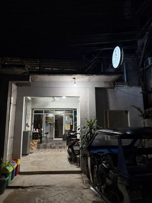 a garage with a car parked inside of it at Seaslugs Travellers Inn in El Nido