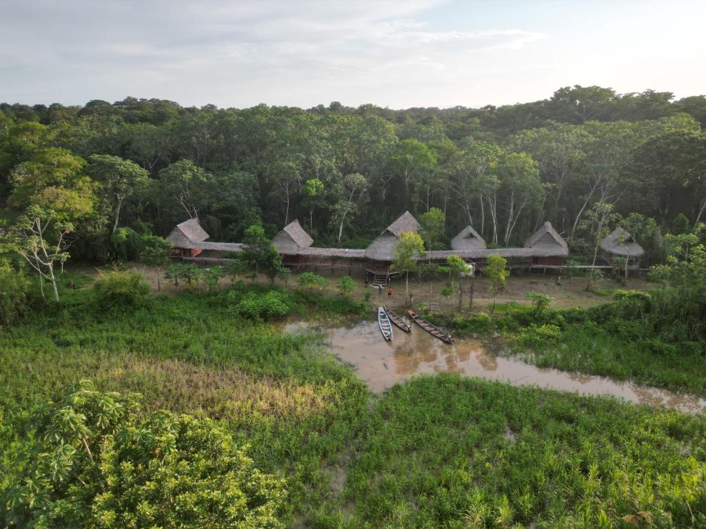 an aerial view of a village with flood waters at CAMUNGO jungle Lodge in indigenous community ALL INCLUSIVE in Puerto Franco