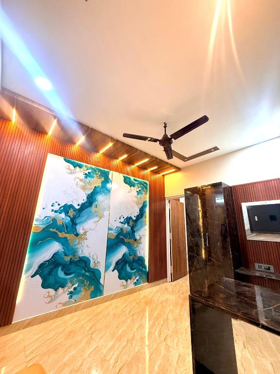 a room with a painting on the wall at 1BHK Stay in Sibsāgar