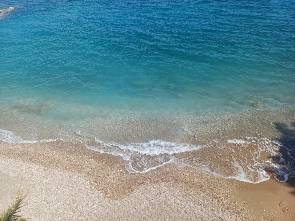 an aerial view of the ocean and the beach at varkiza luxury 2BD apartment in Varkiza