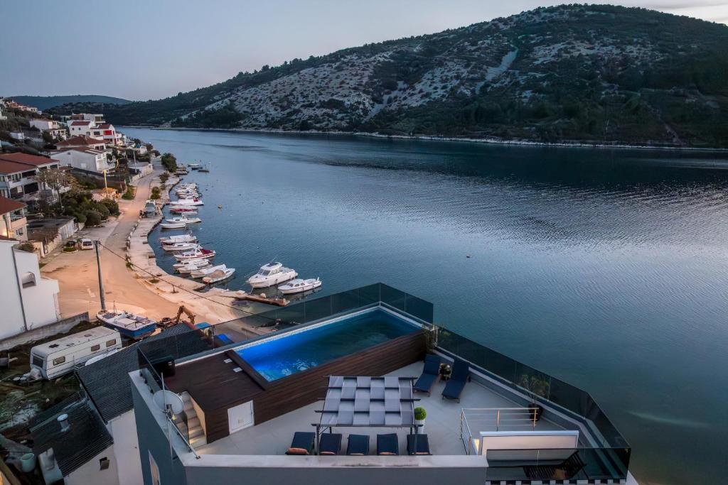 an aerial view of a body of water with boats at Beachfront Luxury Villa in Vinišće