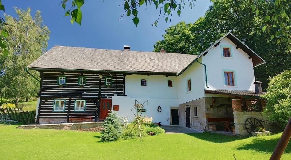 a large white house with a gambrel roof at Chalupa Žernovka in Žernov