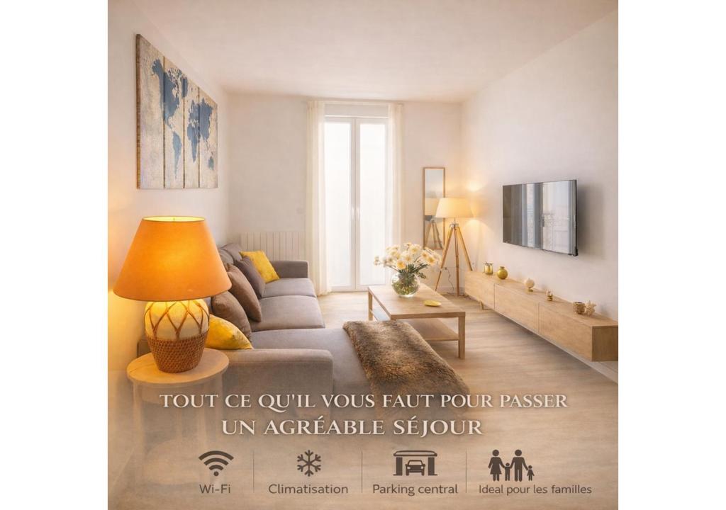 a living room with a couch and a table at ELEGANCE Castillet - Plein Centre Proche Gare Bus et Transports - IDEAL COUPLE ou PRO - Moderne et Confort - OFFRE SPECIALE in Perpignan