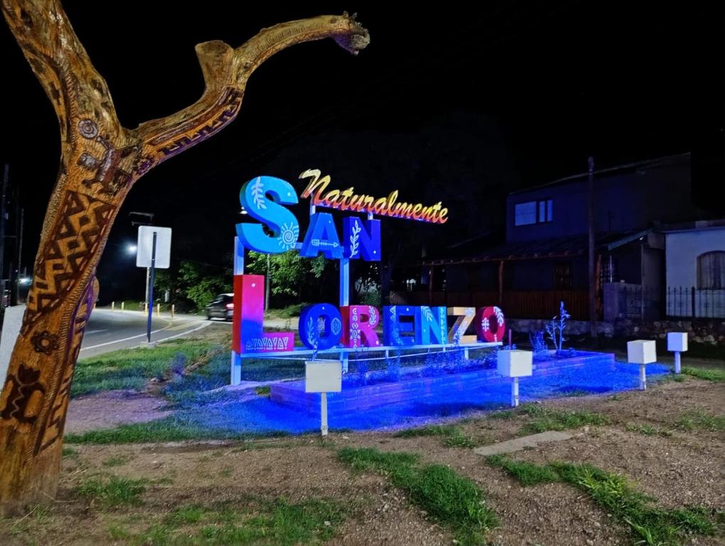a sign for a sa spa or gym at night at Casa de luna in San Lorenzo