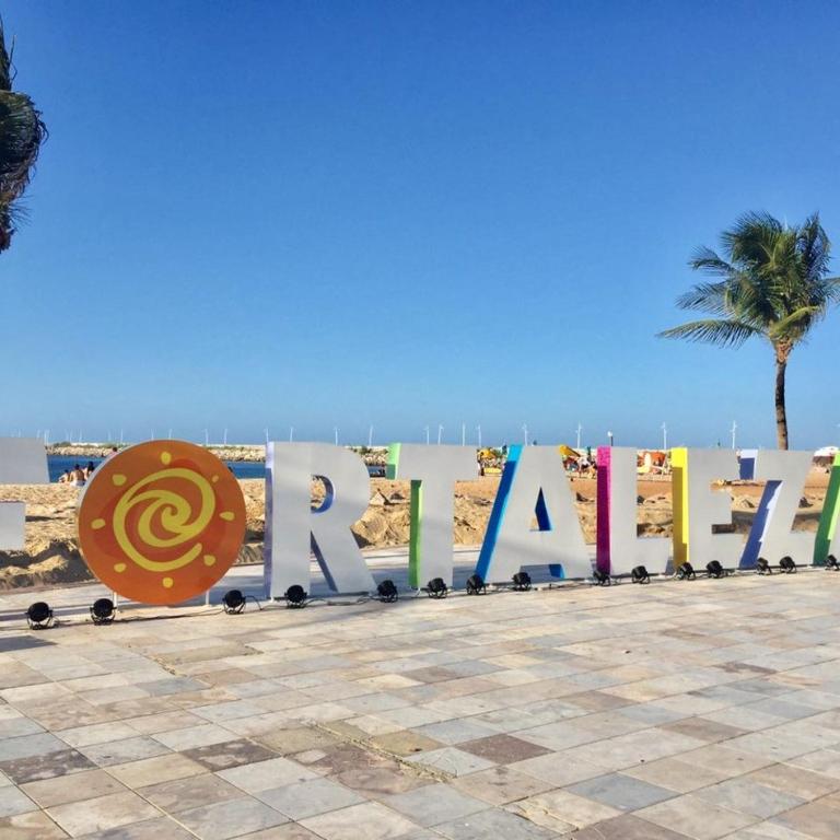 a large sign that says raya on the beach at Pousada Maresia in Fortaleza
