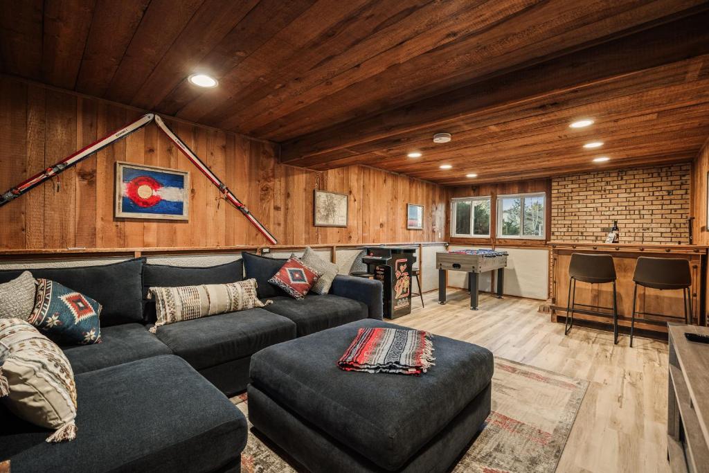 a living room with a couch and a table at The Loveland Haus in Loveland
