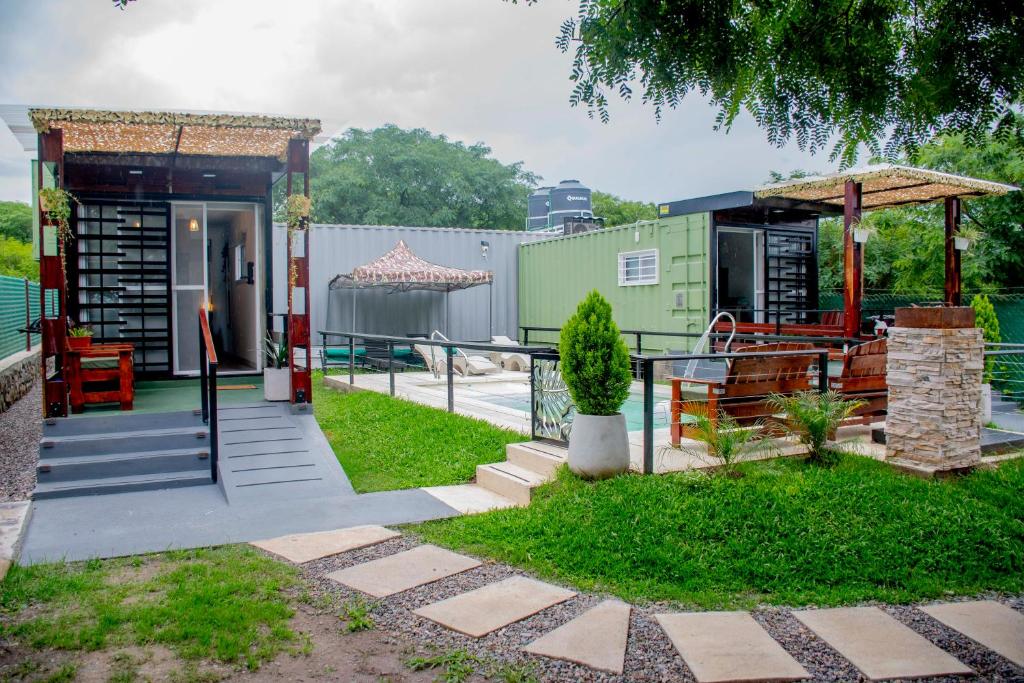a house with a porch and a gazebo at Refugio Lagunas in San Antonio