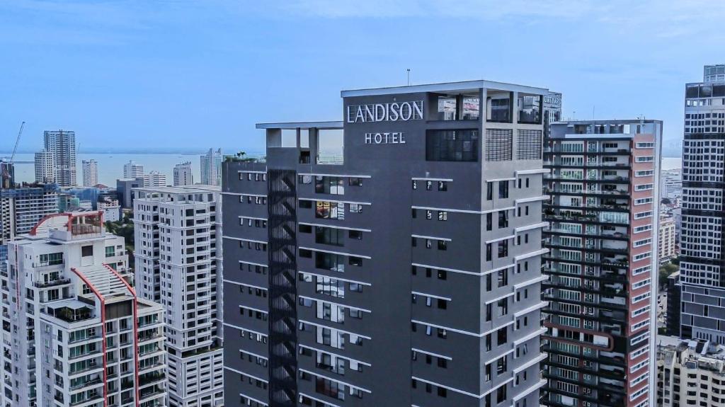 a tall black building with the word laneway hotel on it at Landison Hotel Penang in George Town