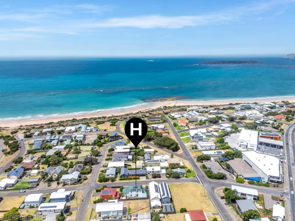 an aerial view of a suburb with a arrow pointing to the ocean at 10 Rupara Family Beach House with Sea Views Linen Included in Hayborough