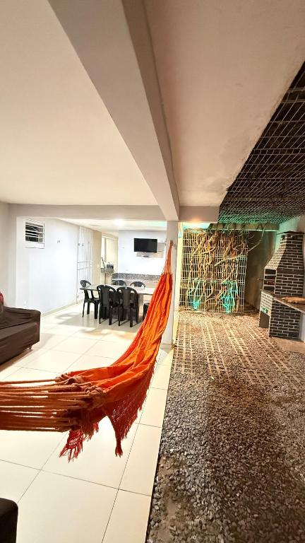 a living room with a large painting on the wall at Comfortable house in Natal in Natal