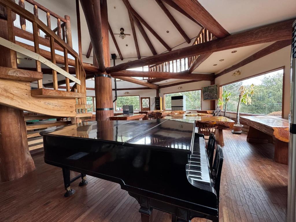 a large room with a pool table and stairs at スピークイージー in Higashiizu
