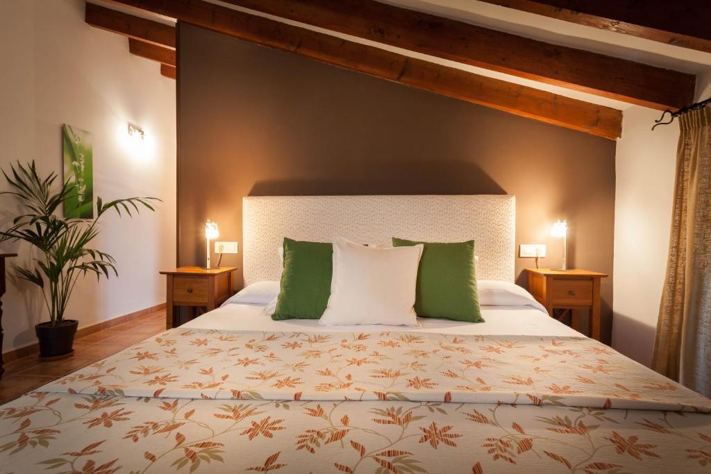 Postel nebo postele na pokoji v ubytování Petit Hotel Alaro