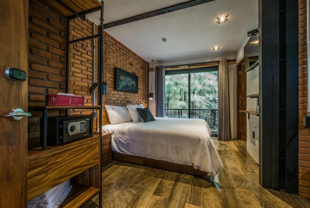 Katil atau katil-katil dalam bilik di Hotel Oxú & Gampling Solo adultos