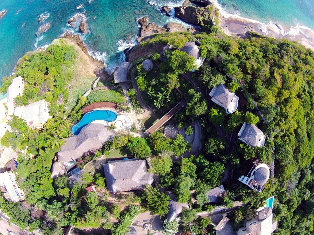 an aerial view of an island in the ocean at Zoa Hotel in Mazunte
