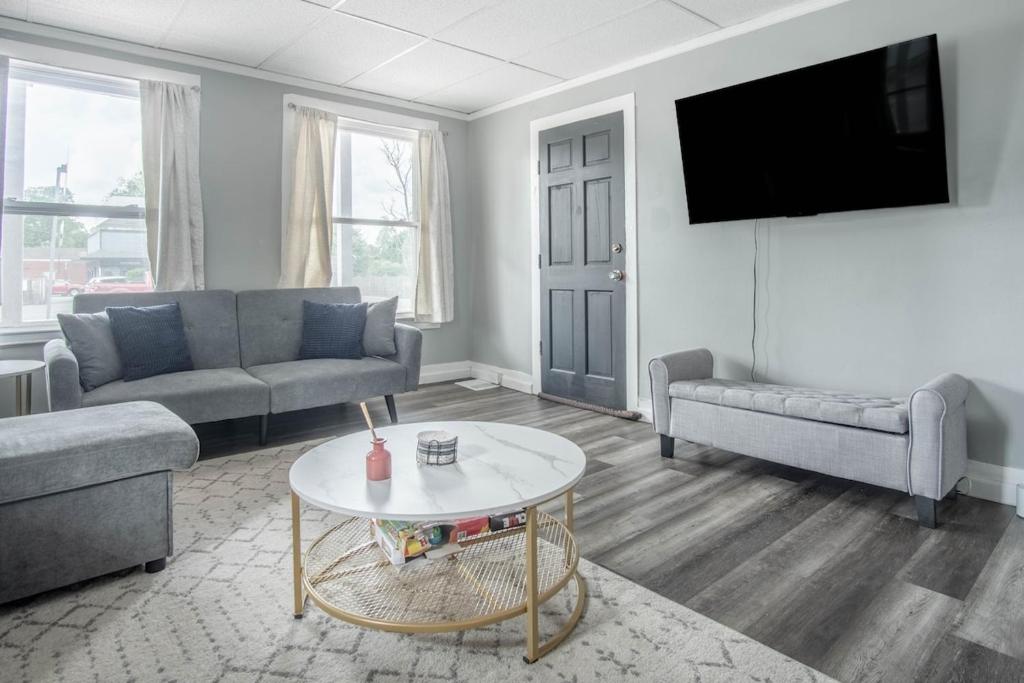 a living room with a couch and a table at Cozy Croghan Apartment in Croghan