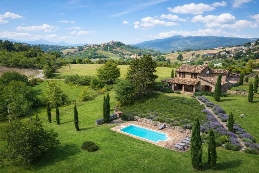 an estate with a swimming pool and a house at VILLA ADELE - Ville Carborello in Crispiero