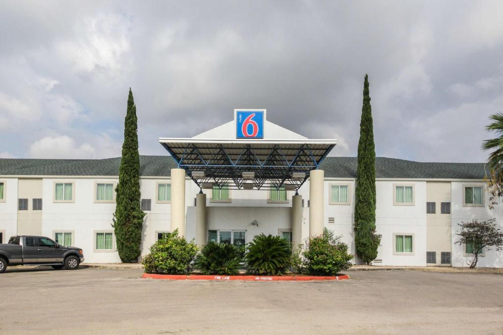 a large building with a large clock on top of it at Motel 6 New Braunfels in New Braunfels