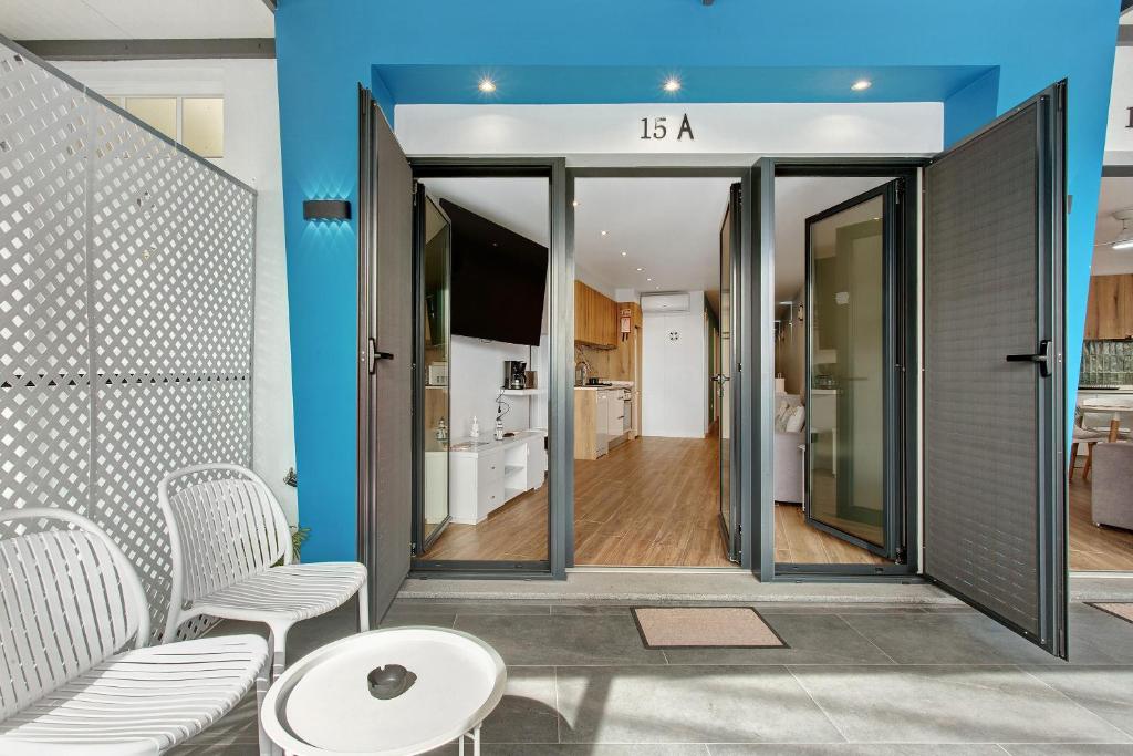 a living room with a table and chairs and a room at O Marinheiro 15A in Caniçal