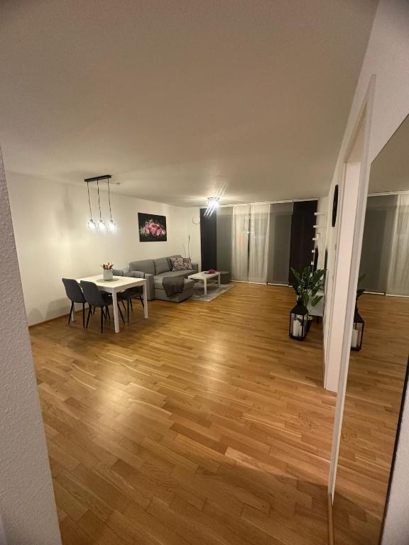 a living room with a table and a couch at SeePERLE 131 in Friedrichshafen