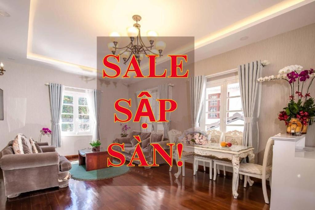 a sale sign in a living room with asale sign in a room at ROY VILLA COFFEE in Da Lat