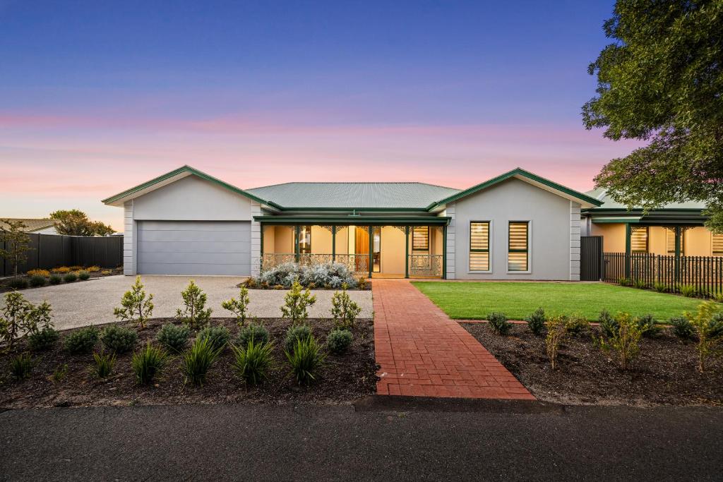a white house with a green roof at Shining House Villa A in Tanunda
